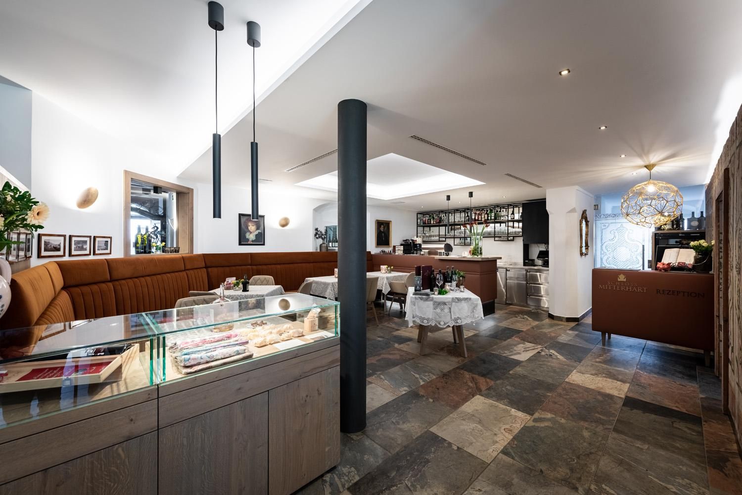 A modern restaurant with an inviting interior. High-quality furnishings and a cozy atmosphere create a pleasant place to dine.